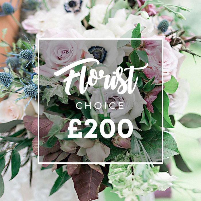An artful, refined Florist Choice bouquet from Finsbury Flowers sits at the heart of this image, its soft pastel palette and understated elegance inviting calm. The color story flows through gentle pinks and creams, with hints of pale lavender and muted tones that feel timeless. The bouquet features delicate light pink garden roses opened to reveal satin petals, a cluster of white anemones with their dramatic dark centers, and subtly purple-grey roses that bring a modern edge. Blue eryngium thistles provide crisp texture, while an abundance of green foliage-slender eucalyptus-like leaves and deep burgundy or plum-toned leaves-pulls the palette together for a natural, almost wild finish. The arrangement reads as substantial yet restrained, a sign of true curation rather than volume.

The overlay sits on a soft white rectangle, marking the bespoke nature of the piece and its price as a symbol of premium service. Ideal for weddings, anniversaries, or a refined gift, the image, with shallow depth of field and gentle outdoor light, invites the viewer to linger on petal texture, color nuance, and the intimate balance of florals and greens. For customers in the Finsbury area, this Florist Choice bouquet is available for same-day delivery, crafted with seasonal stems and the care that defines a neighborhood florist known for quality. It embodies calm, confident elegance and the craft of a local specialist.