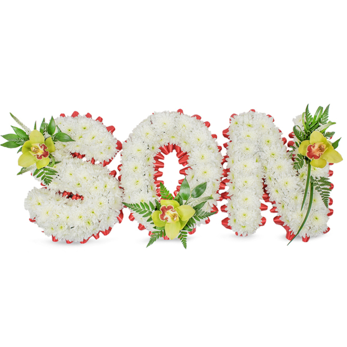 A carefully assembled, three-dimensional tribute spells SON in block letters formed entirely from tightly clustered white chrysanthemums, their tiny petals blending into a smooth, cloud-like surface that conveys purity and calm. Each letter's edge is accentuated with a continuous band of red ribbon, looped into small scallops that create a refined, rhythmic border and a strong visual counterpoint to the white blooms. At three deliberate points - nesting in the S's curl, cradled at the base of the O, and poised on the upper arm of the N - sit lime-green Cymbidium orchids with distinctive reddish-brown markings in their throats; their waxy texture and soft fragrance add an understated elegance. Surrounding the orchids, a mix of glossy green leaves and delicate fern fronds introduces depth, vertical movement, and a natural, garden-like softness against the sculpted letters. The entire composition is shown on a simple white field under diffused light, which reveals the meticulous floral padding and the clean interplay of colour: bright lime, deep green, radiant white, and the punctuation of red. Intended as a personalised funeral or graveside tribute to a beloved son, the arrangement balances restraint and warmth, a statement of remembrance that reads as both intimate and formal. Made to the exacting standards of a local workshop, this style is a familiar choice for families in Finsbury and nearby Old Street or City Road; Finsbury Flowers often creates similar commissions for memorials and services in the area.