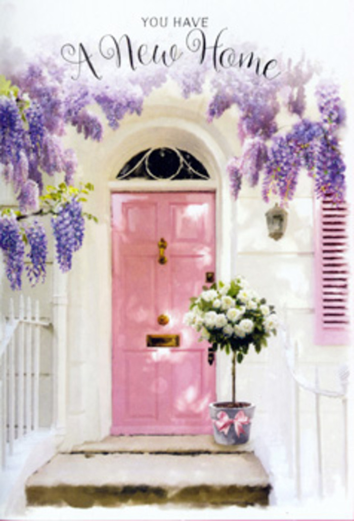 The photograph presents an inviting Finsbury doorway that feels like a snapshot of a perfectly timed housewarming delivery. A pastel pink door stands centre stage, its surface smoothly painted in a hue that sits between delicate rose and dusky blush, adding warmth and personality to the simple, whitewashed façade. The surrounding wall has a softly uneven texture, catching the light in subtle ways that suggest character and history, much like the older streets around Finsbury's leafy squares. Overhead and to the sides, wisteria descends in luxurious, trailing curtains, their blossoms a rich mix of lavender, pale purple, and soft lilac. Each cascade is dense with small, pea-like flowers, some in tight clusters, others slightly more open, creating a feeling of movement and abundance. The wisteria frames the door in a loose, romantic arch, as though nature itself is welcoming anyone who steps up. On the doorstep, a grey tin bucket provides a sturdy yet understated base for a lush floral display. It is filled with creamy white and ivory-toned roses, their petals densely packed and gently curling outwards at the tips. The roses vary subtly in size and angle, giving the arrangement a natural, hand-gathered feel rather than strict formality. Soft green foliage tucks between the heads, offering contrast and a sense of freshness, like leafy stems freshly trimmed by a skilled florist. A pale pink satin ribbon wraps around the bucket, tied in a relaxed bow whose trailing ends lie against the step in an easy, unforced gesture. Sunlight glances across the petals and the metal, casting delicate shadows and infusing the doorway with a tranquil glow. The whole composition feels perfect for marking a new chapter in a Finsbury home, a floral threshold that quietly says, You've arrived; this is home now.