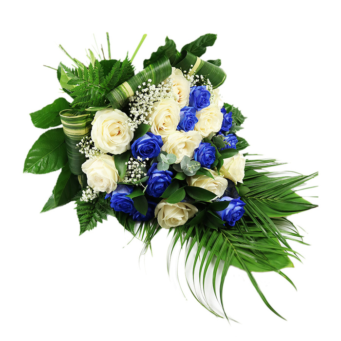 A luxurious cascading spray of blue and white roses is set against a pristine white background, its teardrop outline unmistakable as it widens generously at the top and narrows gracefully toward the tip. The centre of the composition is dense with roses, each bloom fully open so that individual petals can be imagined curling softly at the edges. Numerous ivory and off-white roses are evenly interlaced with an equally abundant number of rich, sapphire blue roses whose intense colour adds drama without overpowering. This interplay of tones gives the arrangement depth and a sense of quiet movement, as if the colours are gently echoing one another. Throughout the rose canopy, fine sprays of white baby's breath peek out, their tiny blossoms forming a subtle, cloud-like layer that enhances the softness of the overall look. Encircling the flowers is a varied selection of greenery: feathery, bright green ferns lift around the upper edges; glossy, dark green broad leaves create a shadowed backdrop that makes every petal stand out; and long, elegant palm fronds trail downward from the base, defining the cascading silhouette and adding a sense of flow. Delicate sprigs of silvery, eucalyptus-like foliage are tucked discreetly amongst the roses, introducing cooler tones and different leaf shapes. In several places, wide green leaves are folded into refined bands and woven through the design, lending a tailored, almost architectural detail that speaks to professional craftsmanship. The mood is one of solemn grace, ideal for a sympathy spray or memorial tribute chosen by families in Finsbury for services near Holborn, King's Cross, or the quieter residential streets off Rosebery Avenue, conveying respect, peace, and enduring affection.