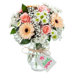 Bathed in streaming morning light, a generous bouquet of pastel flowers captures the welcoming atmosphere of Finsbury, set against a brilliant white background. The arrangement features full, peach-pink roses-each one a swirl of tenderness and style-paired with vivid peach-orange gerberas that instantly draw the eye with their lively, dark-centered faces. Small, fluffy white chrysanthemums and cloud-like sprigs of baby's breath weave softness and depth through the bouquet, creating a layered and almost cloud-kissed texture that echoes the open ambiance of local streets. Scattered greenery, likely fresh eucalyptus, injects notes of forest green and clean aroma, rounding out the composition. All elements are gathered in a clear, gently rounded glass vase, which reveals the natural tangle of submerged stems and adds a note of classic elegance. Around the vase neck, a rustic twine tie supports a simple white tag, hinting at a heartfelt message for a birthday, new beginning, or moment of gratitude. This bouquet, crafted by Finsbury Flowers, beautifully expresses gentle affection and neighbourly warmth, perfect for brightening up spaces near Clerkenwell Green or Rosebery Avenue.