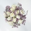 This bouquet is a celebration of Finsbury's refined spirit-creamy white roses, plush and full, embraced by a lively drift of lavender statice. Each rose seems to glow with promise, petals gently curling open to reveal their delicate hearts, while the statice rises and branches around them like a soft perfume on a spring breeze across Wilmington Square. The interplay of colour and texture is quietly enchanting: the plushness of the blooms and the statice's tiny, chalky florets complement each other with effortless grace. In the daylight, the palette is fresh and hopeful, ideal for commemorating weddings, anniversaries, or any cherished occasion in the heart of Islington. The air is tinged with a subtle, powdery hint- reminiscent of lilac blossoms along the Regent's Canal. Every detail is thoughtfully arranged by the local team at Finsbury Flowers, ensuring a message of sincerity, comfort, and lasting affection. Whether presented as a heartfelt gesture or admired in a sunlit flat, this bouquet captures the calm romance and quiet celebration that define Finsbury's floral artistry.