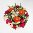 Crafted to capture the effervescent essence of Finsbury, this joyful bouquet is a celebration of colour, texture, and neighbourhood character. Orange gerberas form a radiant centre, their bold petals catching the light much like sunset over Spa Fields. Around them, plush magenta carnations and silken pink roses build a sumptuous, tactile tapestry; every bloom looks inviting enough to touch. Interspersed with touches of snowy white alstroemeria and gentle clusters of daisies, the bouquet sparkles with hints of steppe-freshness, reminiscent of dewdrops lingering in the quiet corners of Myddelton Square. Lush greenery frames the entire display, its glossy leaves evoking the abundant flora flourishing in Finsbury's gardens. Though vibrant and bold, the palette is expertly blended for a harmonious and optimistic feel. Whether celebrating a birthday or an exciting milestone, this bouquet delivers visual delight and gentle fragrance-a heartfelt gift from the Finsbury Flowers team, inspired by the local energy and warmth of our community.